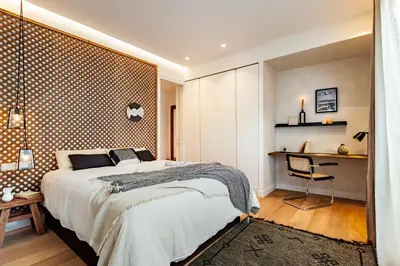 a room with a wooden door and a ladder at BENI - 1 bedroom apartment with pool and terrace in Gracia in Barcelona
