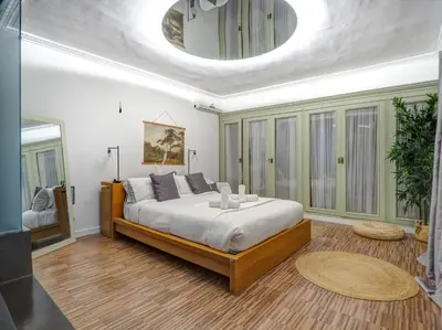 a bedroom with a large bed in a room at Villa Nirvana by Hello Homes Sitges in Sitges