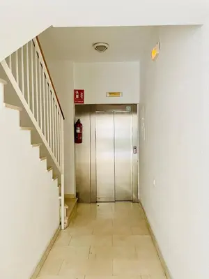 a hallway with a elevator and a staircase at Sant Pau Beach Home with terrace in Sitges