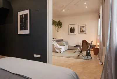 a bedroom with a bed and a living room at DENALI - Stylish apartment in center of Barcelona in Barcelona