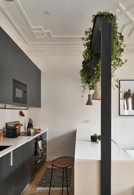 a living room with a white couch and a kitchen at DENALI - Stylish apartment in center of Barcelona in Barcelona