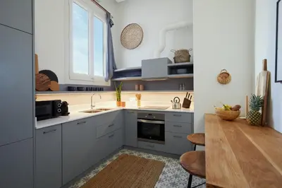 a living room with a couch and a table at SAPO - Two bedroom in the heart of Barcelona in Barcelona