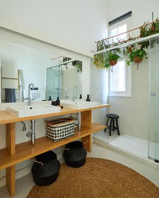 a bedroom with a bed with a black and white blanket at SAPO - Two bedroom in the heart of Barcelona in Barcelona
