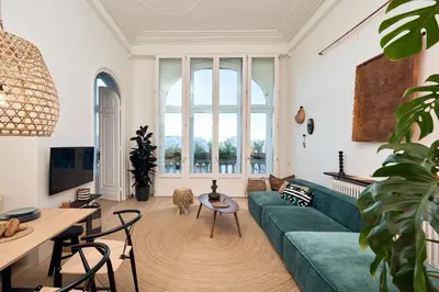 a bedroom with a bed and a large mirror at SAPO - Two bedroom in the heart of Barcelona in Barcelona