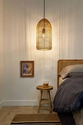 a bedroom with a bed and a table with a lamp at NAZARE - Two Bedroom Apartment in Eixample in Barcelona