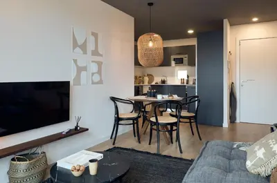 a bedroom with a bed with a blanket on it at AGAFAY - Two bedroom apartment in Sagrada Familia in Barcelona