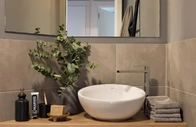 a bathroom with a white sink and a mirror at AGAFAY - Two bedroom apartment in Sagrada Familia in Barcelona