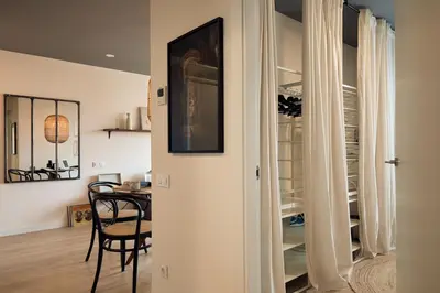 a living room with a couch and a table and chairs at AGAFAY - Two bedroom apartment in Sagrada Familia in Barcelona