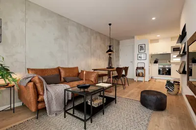 a room with a table and a wall with a coat at NEVIS - Modern two bedroom apartment in Sagrada Familia in Barcelona