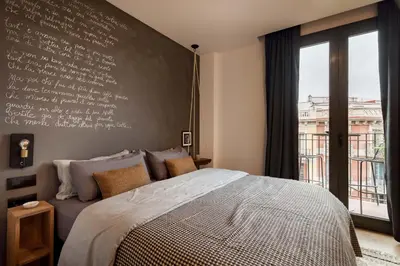 a living room with a couch and a dresser at NEVIS - Modern two bedroom apartment in Sagrada Familia in Barcelona