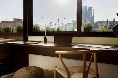 a living room with a white couch and a table at DOURO - Penthouse with a view of the Sagrada F. in Barcelona