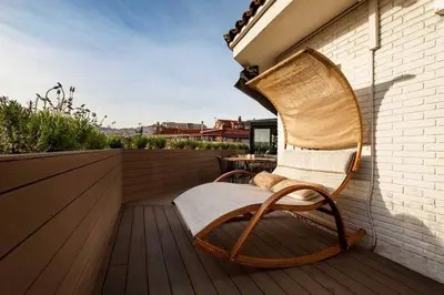 a kitchen with a counter with a book on it at DOURO - Penthouse with a view of the Sagrada F. in Barcelona
