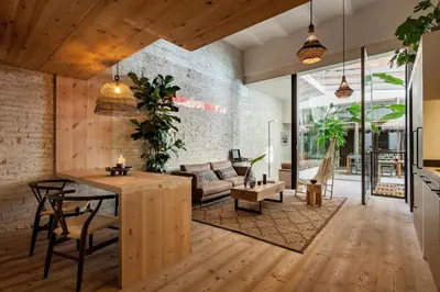 a room with wooden shelves on a wall at AMAZONAS - Three bedroom duplex in Gracia in Barcelona