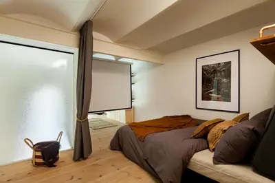 an empty room with a brick wall and a door at AMAZONAS - Three bedroom duplex in Gracia in Barcelona