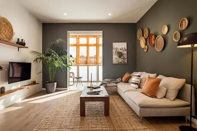 a living room with a bed and a mirror at TEFE - Two Bedrooms apartment in Gracia in Barcelona