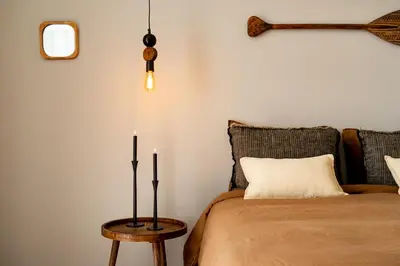 a room with a chair and a potted plant at TEFE - Two Bedrooms apartment in Gracia in Barcelona