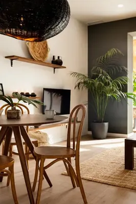 a dining room with a wooden table and chairs at TEFE - Two Bedrooms apartment in Gracia in Barcelona