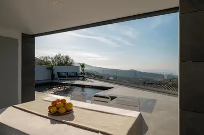 a bowl of fruit sitting on a table on top of a house at 4 BR vila 25 minutes to Barcelona Fantastic sea views pool in Alella