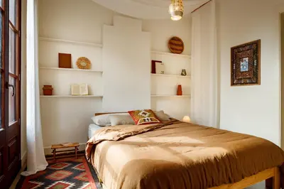 a room with a door with lights on the wall at HIDALGO - Two bedroom apartment in Eixample in Barcelona