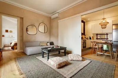a bedroom with a bed in a room with shelves at HIDALGO - Two bedroom apartment in Eixample in Barcelona