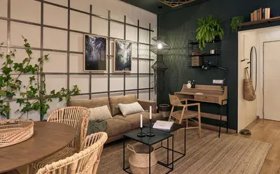 a bedroom with a bed with a green wall at ERAWAN - One bedroom apartment in Eixample in Barcelona