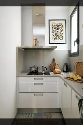 a desk with a chair and a lamp on a wall at ERAWAN - One bedroom apartment in Eixample in Barcelona