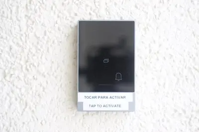 a remote control hanging on a wall at Hey Rooms in Cerdanyola del Valles