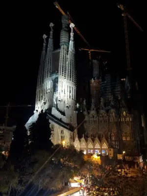 a large building is lit up at night at Sagrada Familia 4 Bedrooms 