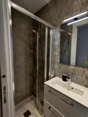 a bathroom with a shower and a sink at Stylish apartments Camp Nou in Hospitalet de Llobregat