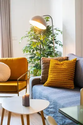 a living room with a couch and a table at Apartamento con gran patio y excelente ubicación! in Mataró