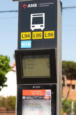 a parking meter with a bus on top of it at Beachfront Sunny Apartment , Sea & Mountain View in Castelldefels