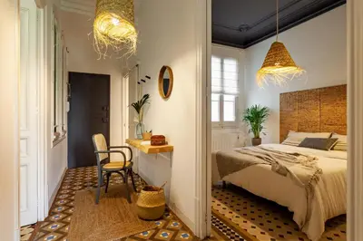 a living room with a couch and a table at LEGE - Two bedroom apartment in Mallorca St in Barcelona