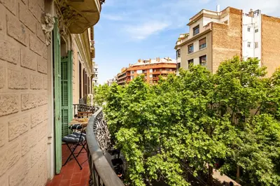 a corridor with a table and chairs in a hallway at LEGE - Two bedroom apartment in Mallorca St in Barcelona