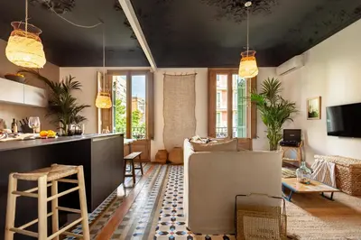 a living room with a couch and a table at LEGE - Two bedroom apartment in Mallorca St in Barcelona