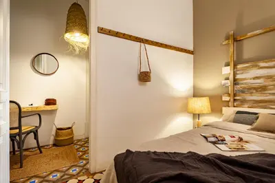 a living room with a couch with pillows at LEGE - Two bedroom apartment in Mallorca St in Barcelona