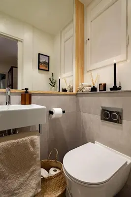 a bathroom with a white toilet and a sink at MILOS - Two bedroom apartment in Mallorca St in Barcelona
