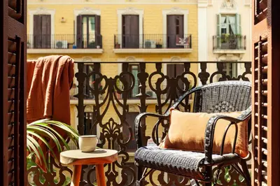 a bedroom with a large bed with a wooden headboard at MILOS - Two bedroom apartment in Mallorca St in Barcelona