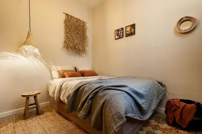 a kitchen with white cabinets and a counter top at MILOS - Two bedroom apartment in Mallorca St in Barcelona