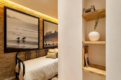 a room with a towel on a chair and a plant at LEBLON - Two Bedroom Apartment in Eixample in Barcelona
