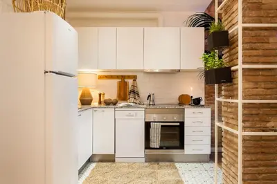 a living room with a couch and a table at LEBLON - Two Bedroom Apartment in Eixample in Barcelona