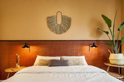 a bedroom with a large bed with white walls at TAMAN - Three Bedroom Apartment in Casanova Street in Barcelona