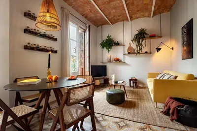 a bedroom with a bed and a dresser at NANAY - Two bedroom apartment in Gracia in Barcelona