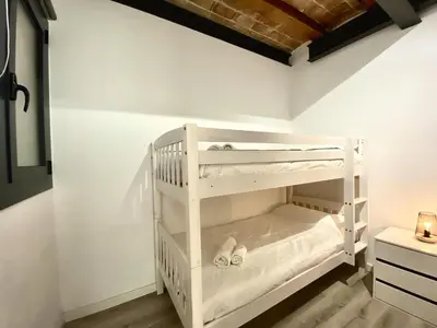 a white bunk bed in a room at Sants Montjuic Olympic View in Barcelona