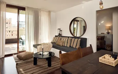 a bedroom with a bed and a lamp on a table at TAKLA - Two bedroom apartment in Diputación St in Barcelona