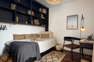 a rooftop patio with a table and chairs and cactus at TAKLA - Two bedroom apartment in Diputación St in Barcelona