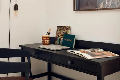 a kitchen with black cabinets and a sink at TAKLA - Two bedroom apartment in Diputación St in Barcelona