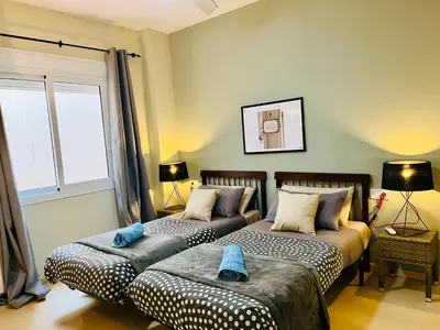 a bedroom with two beds and a window at Magic Camp Nou in Barcelona
