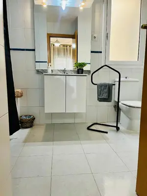 a bathroom with a sink and a toilet at Magic Camp Nou in Barcelona