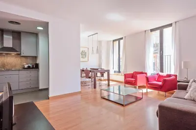 a living room with a couch and a table at Habitat Apartments Carders in Barcelona