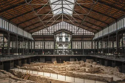 a large building with a large room filled with ruins at Habitat Apartments Carders in Barcelona